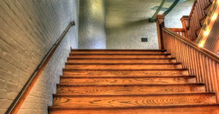 Wooden staircase with spindles and handrail, UK spindle spacing calculator