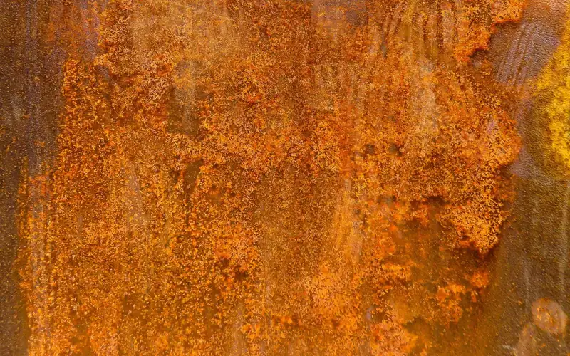 weathered rusted iron surface texture showing corrosion buildup weathered rusted iron surface texture showing corrosion buildup