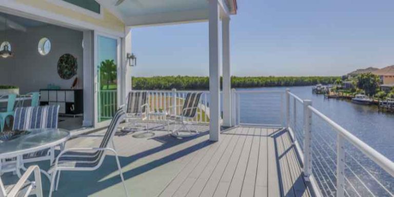 gray composite decking overlooking water, an example of a cool-toned Trex color family
