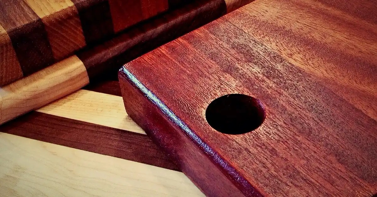Acacia wood cutting board showing food safe hardwood grain and finish