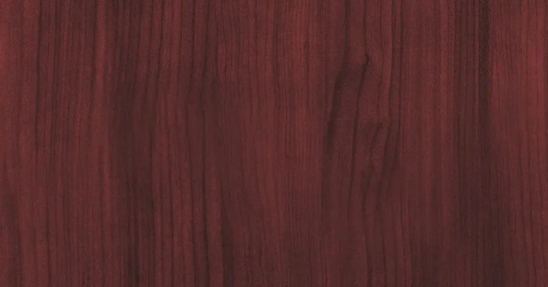 Close-up of African mahogany wood grain showing reddish-brown color and fine texture