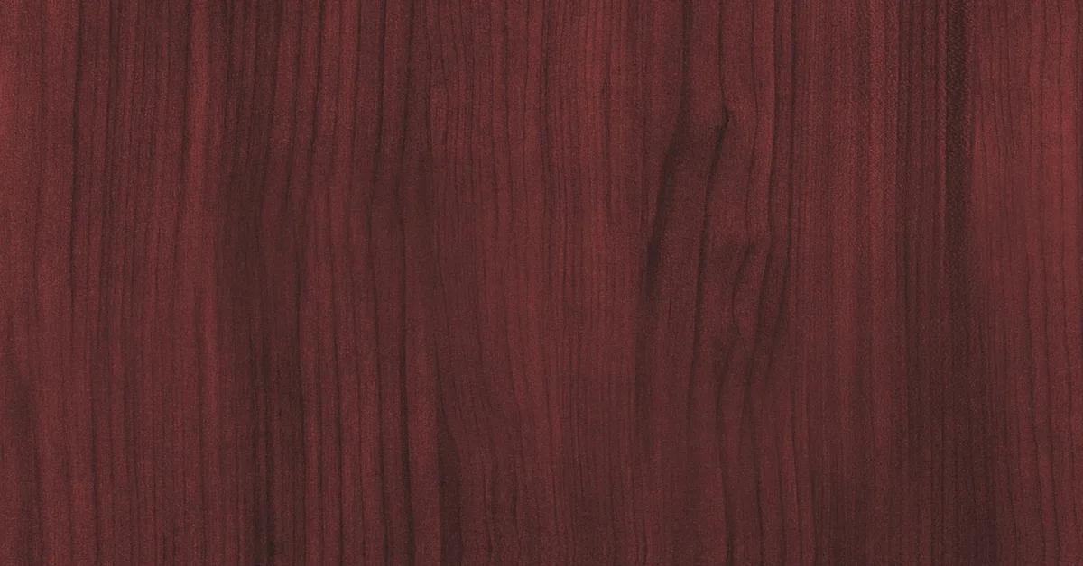 Close-up of African mahogany wood grain showing reddish-brown color and fine texture