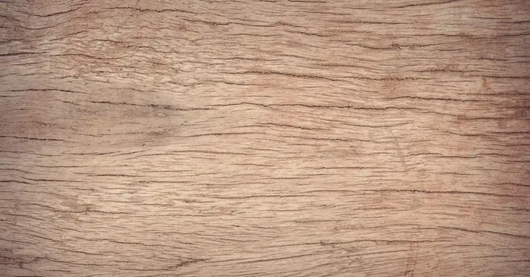 close-up of light tan alder-toned wood grain showing warm reddish undertones