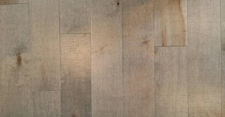 pale maple hardwood plank flooring showing natural grain and mineral streaking