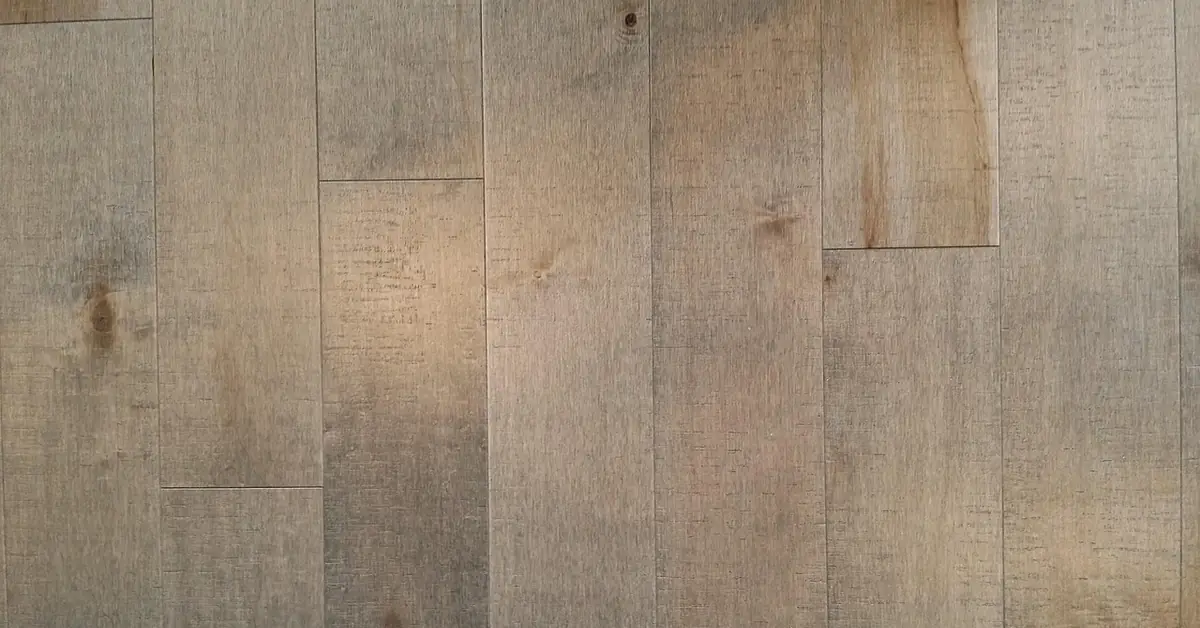 pale maple hardwood plank flooring showing natural grain and mineral streaking