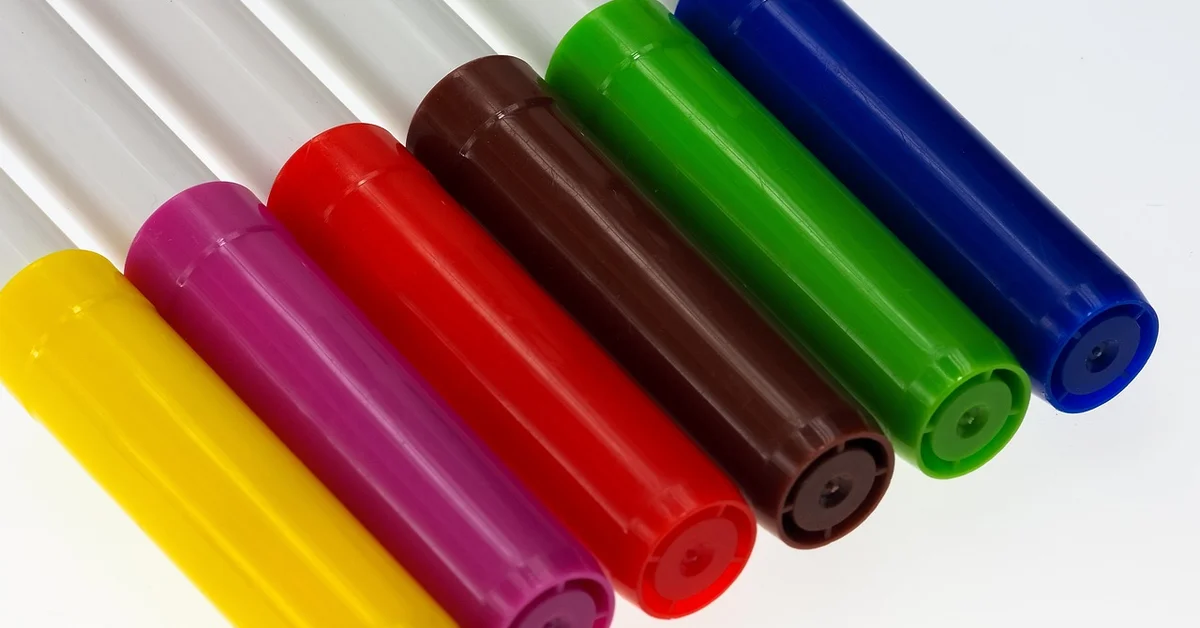 Colorful paint pens and markers for wood craft projects
