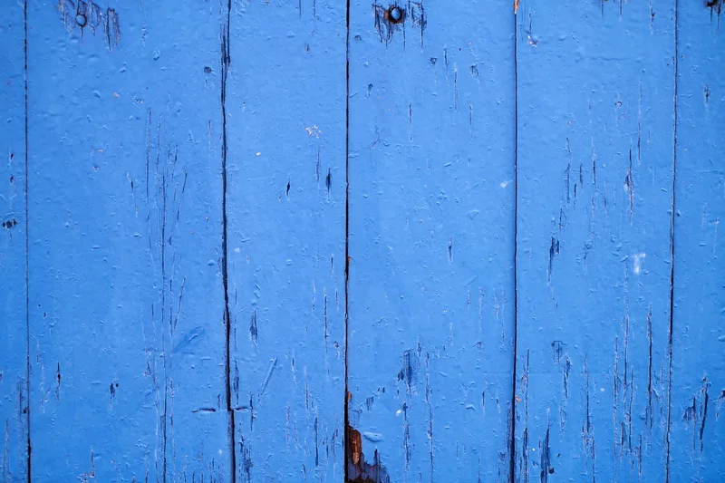Wood floor boards painted a bold blue color