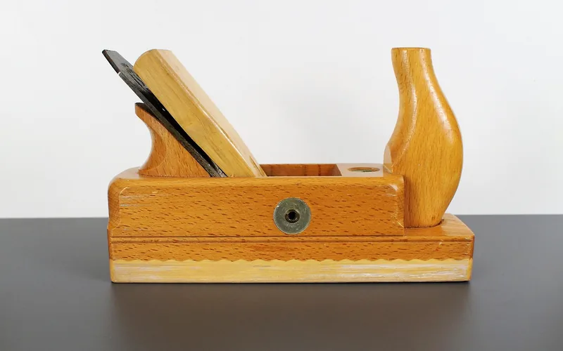 wooden hand plane, a traditional tool used to smooth and refinish solid wood furniture wooden hand plane, a traditional tool used to smooth and refinish solid wood furniture