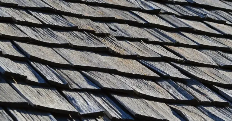 Weathered wood shake shingles showing natural gray patina and wood grain texture