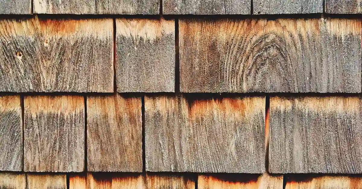 Weathered cedar wood siding planks showing natural rustic grain