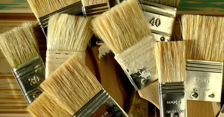 Chalk paint brushes with dried paint residue on the bristles