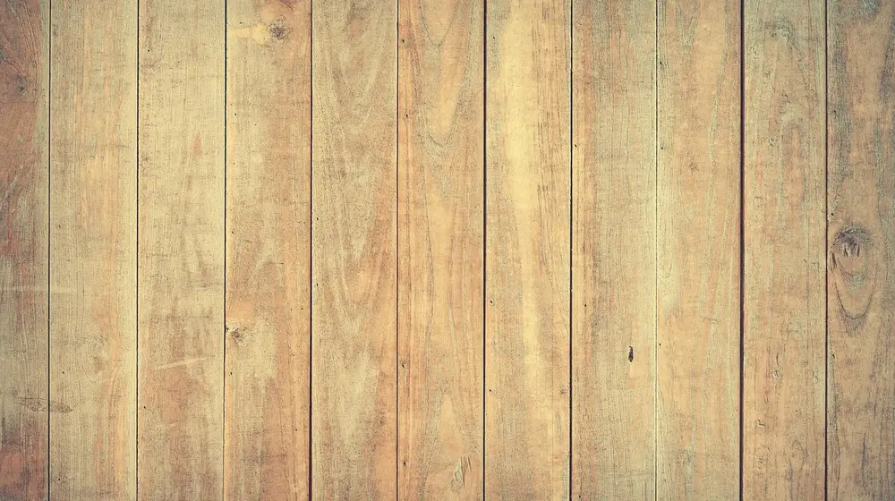 Close-up of sealed hardwood floor planks showing grain and finish