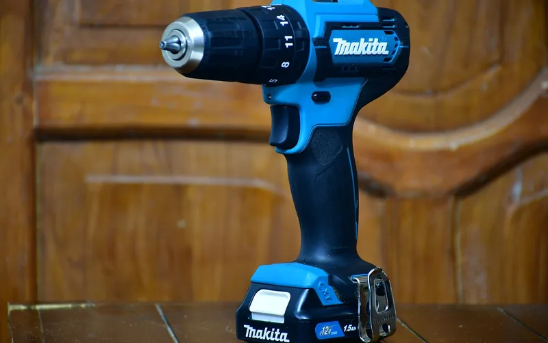 Cordless drill battery pack Cordless drill with a removable rechargeable battery pack attached at the base