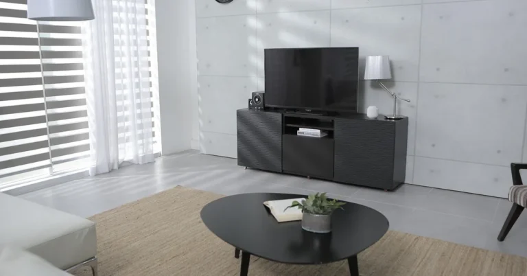 Wood-finish TV console holding a flat-screen television in a living room