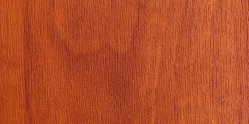 Close-up of genuine mahogany wood grain showing reddish-brown color