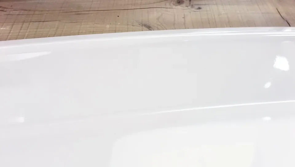 The finished glossy, plastic-like surface after filler, primer, and topcoat