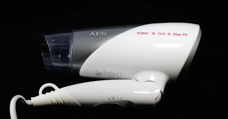 handheld hair dryer used to speed drying of spray-painted surfaces