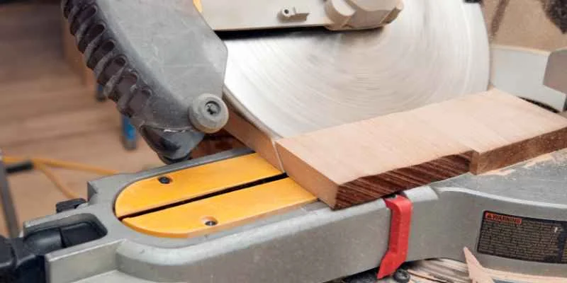 Making a mitered angle cut by hand with a carpenter's square as a guide