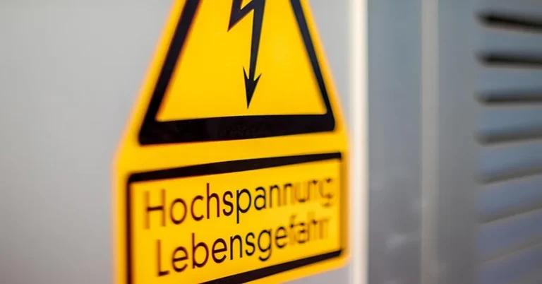 High voltage warning sign, representing the lethal-voltage risk behind Lichtenberg figure wood burner kits