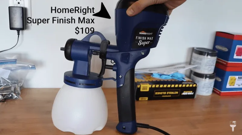 HomeRight Super Finish Max HVLP paint sprayer being held during a furniture refinishing project