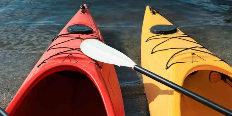Marine-grade sealant and paint applied to a finished plywood kayak