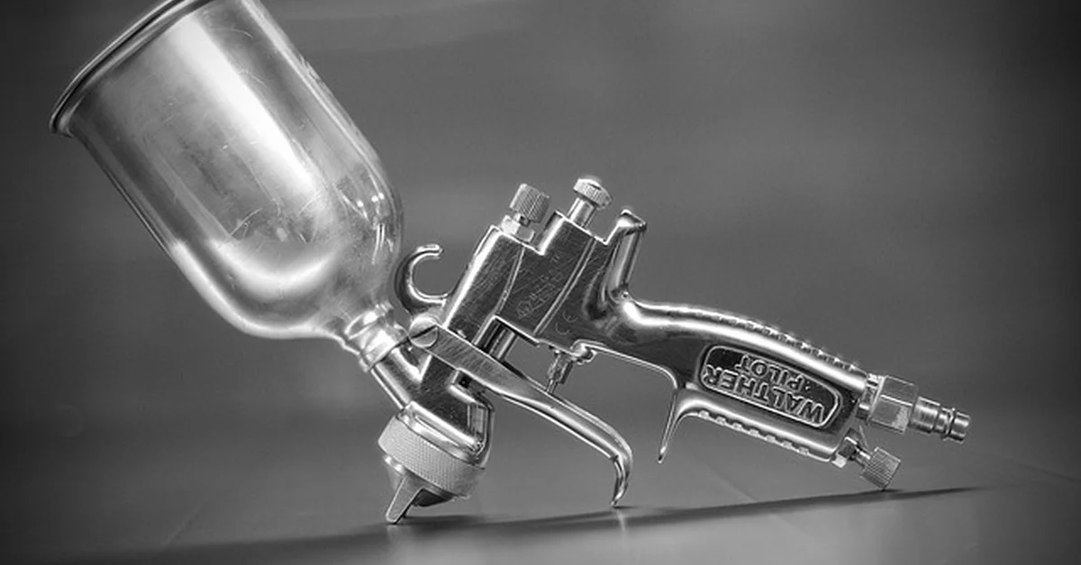 HVLP cup spray gun used for furniture and cabinet finishing