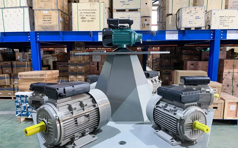 Two induction motors mounted on a display stand showing the enclosed frame and cooling fins typical of table saw induction motors Two induction motors mounted on a display stand showing the enclosed frame and cooling fins typical of table saw induction motors