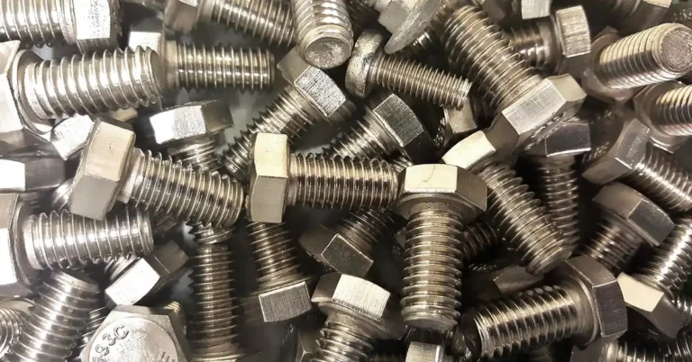 pile of steel hex bolts and nuts used for threadlocker adhesive application