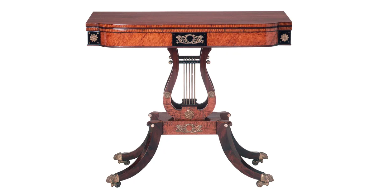 antique mahogany card table with lyre base and brass details