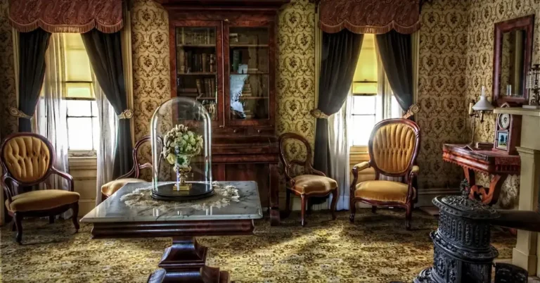 antique mahogany-toned wood furniture in a Victorian-style living room