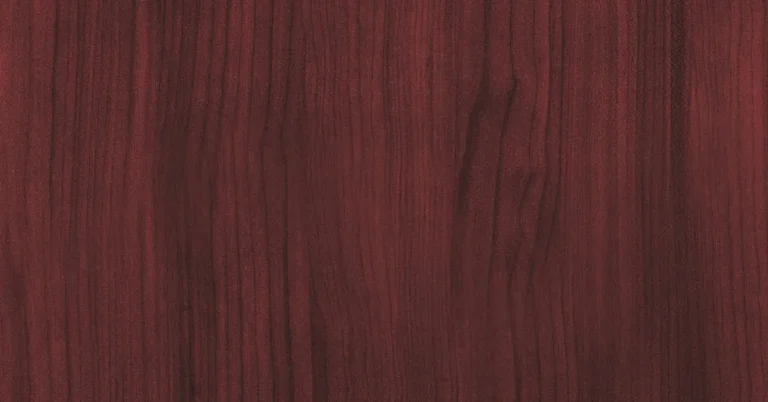 Close-up of genuine mahogany hardwood grain and reddish-brown color