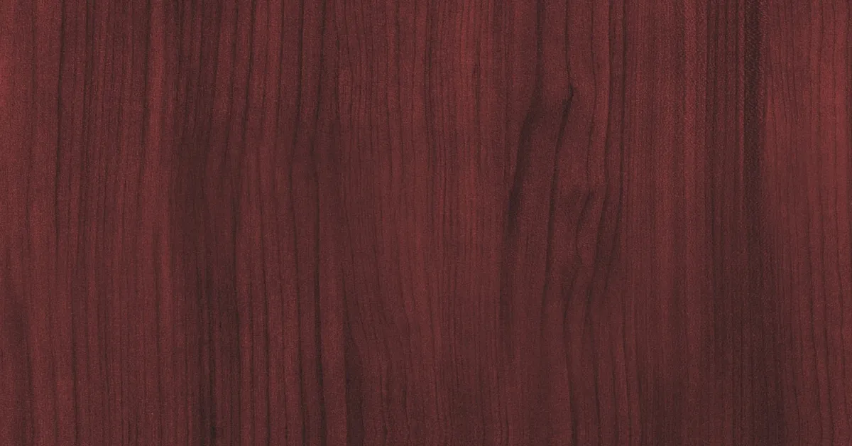 Close-up of genuine mahogany hardwood grain and reddish-brown color