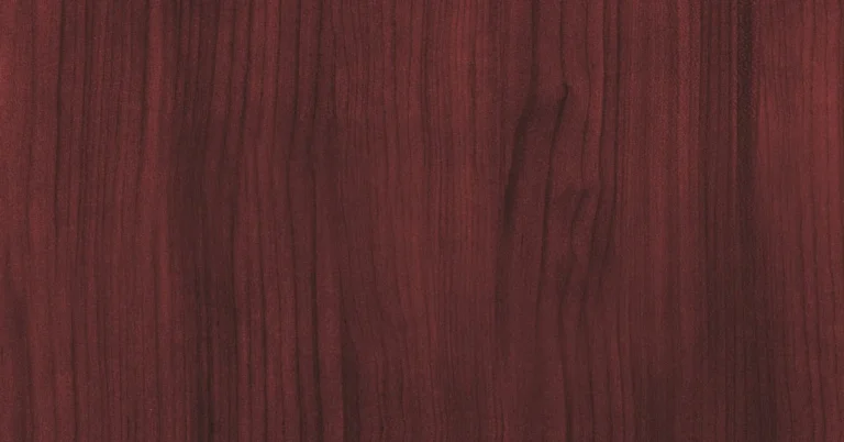 Close-up of mahogany wood grain showing the deep reddish-brown color and straight fine grain typical of veneer sheets