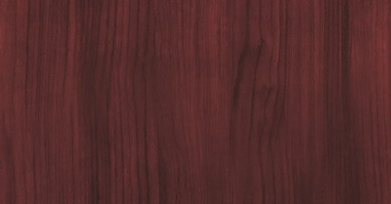 close-up of genuine mahogany wood grain showing its deep reddish-brown color