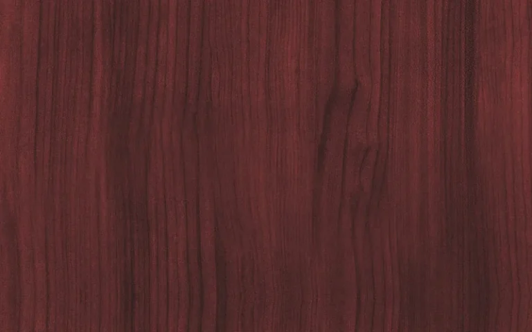 Close-up of genuine mahogany wood grain showing its reddish-brown color and fine, straight texture