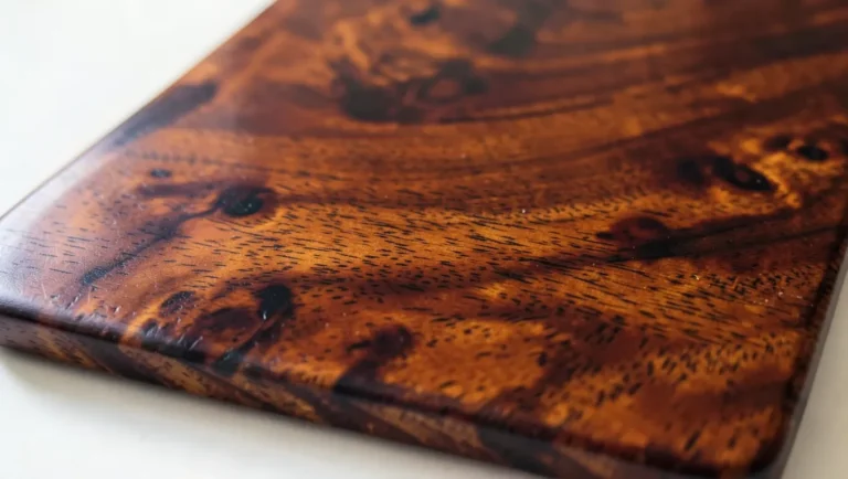 Mahogany wood board with rich reddish-brown grain and oil finish