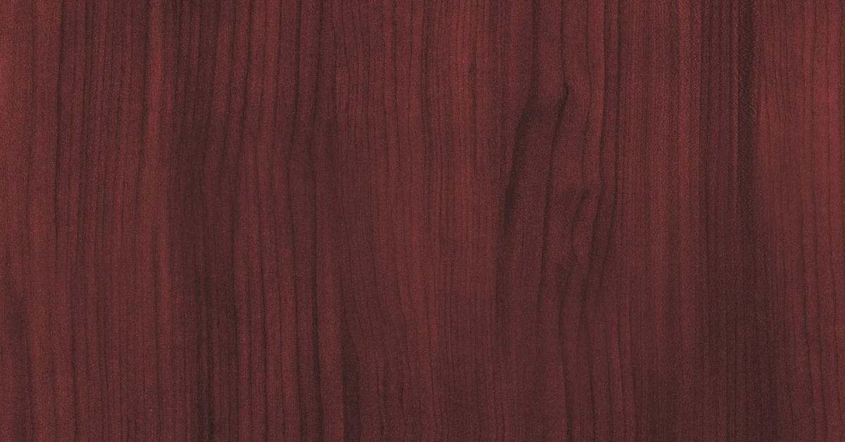 Close-up of rich reddish-brown mahogany wood veneer grain texture