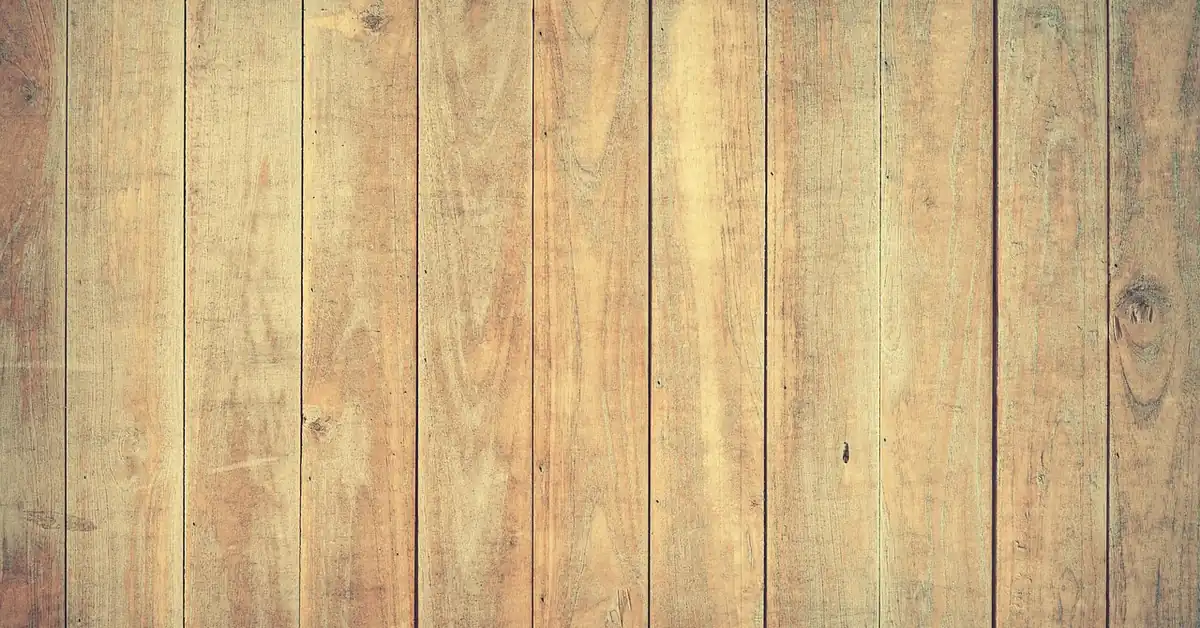 Light hardwood floor planks refinished with a screen-and-recoat, no-sand method