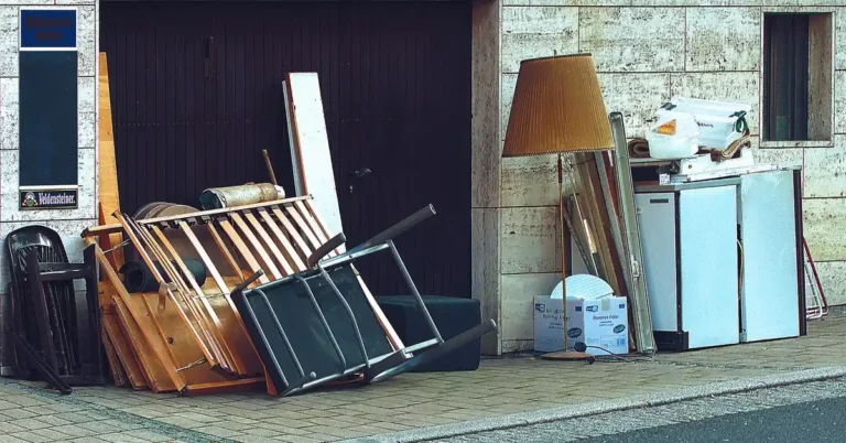 pile of old furniture and appliances set outside for bulky waste removal