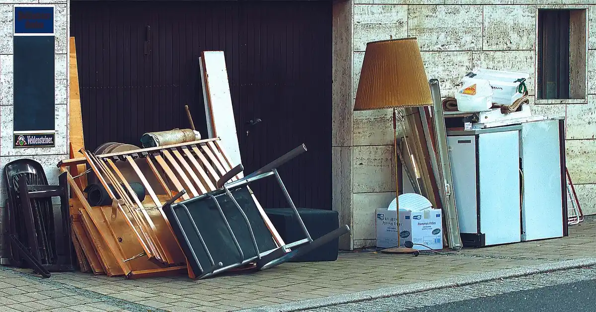 pile of old furniture and appliances set outside for bulky waste removal
