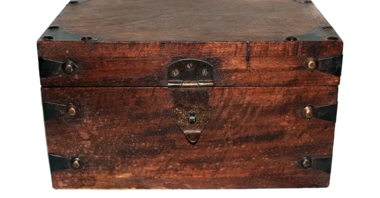 antique wooden box with brass hardware and worn patina, ready for cleaning and restoration