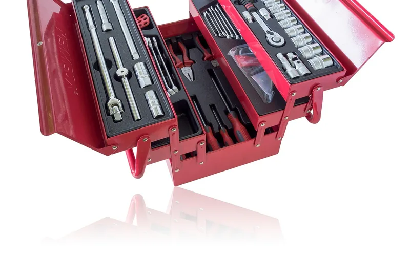 open metal tool case with sockets and hand tools organized in foam cutouts