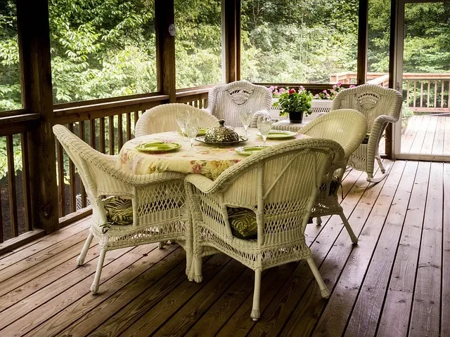 Outdoor dining setup on a covered patio, the kind of dining-height seating the POLYWOOD Vineyard Curveback chair is built for