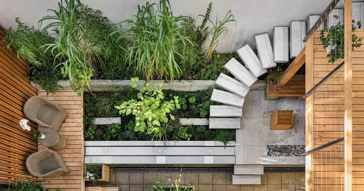 Wood patio deck with landscaped garden showing a composite decking design idea