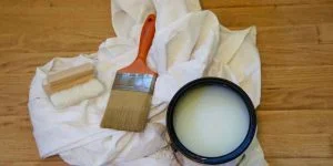 Polyurethane can and brush with drop cloth