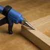 High pressure glue injector tool with fine nozzle for tight wood cracks