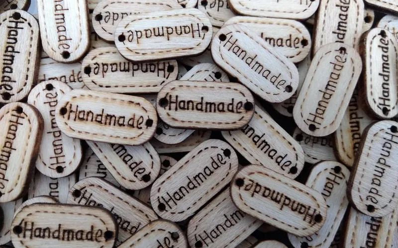 Small wooden tags decorated with pyrography burned lettering