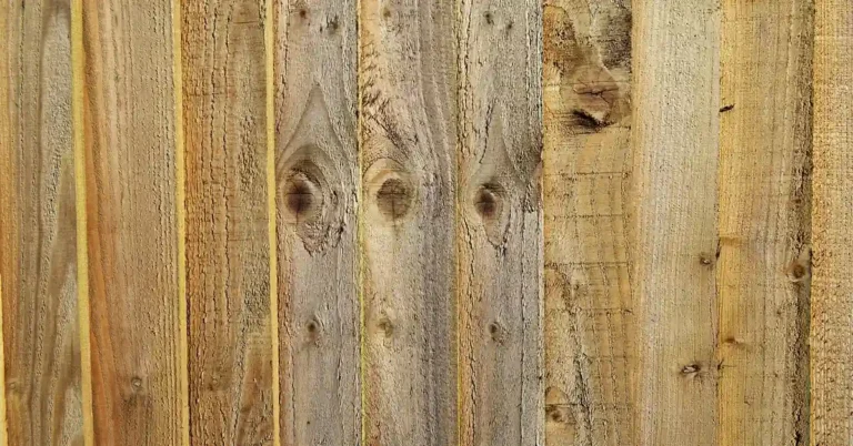 Stack of raw unfinished wood planks showing bare grain with no protective finish