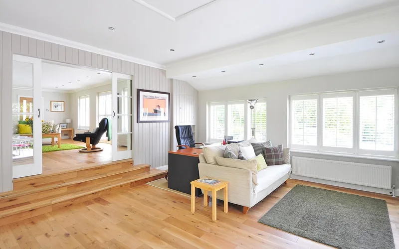 Reclaimed oak hardwood flooring in a living room Living room with reclaimed oak hardwood flooring installed and finished in a bright interior