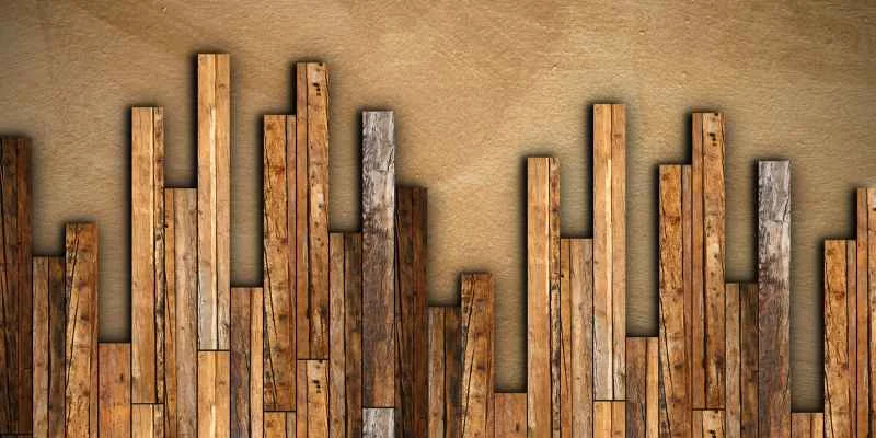 Stacked reclaimed wood planks showing varied grain and tone